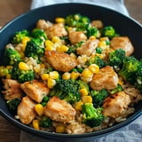 Chicken and rice pan with broccoli and corn